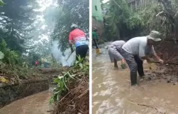 Ketua RT 02 dan warga membersihkan tumbuhan liar dan semak semak di aliran sungai. (Foto: Jumali indrayanto)